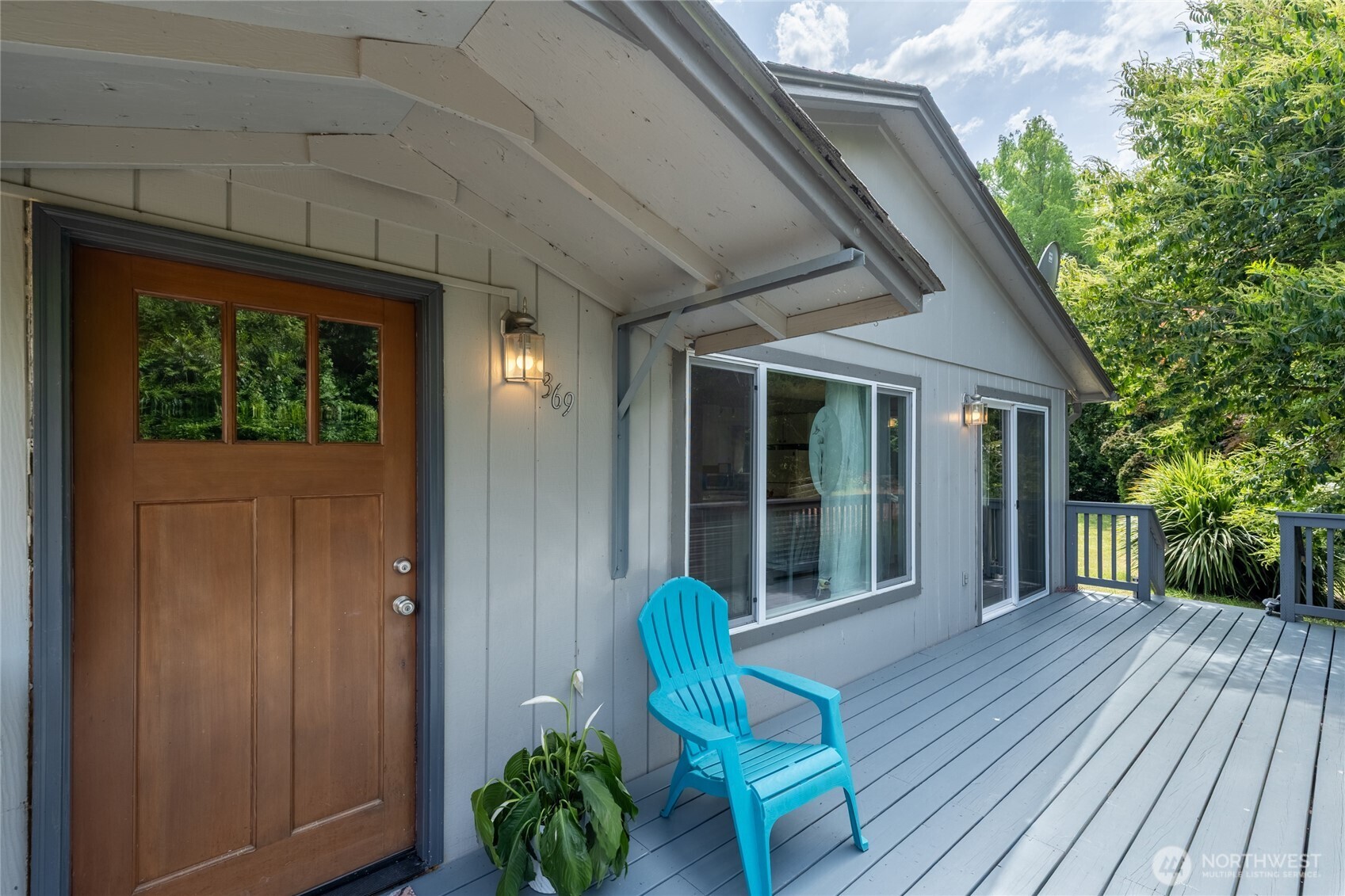 369 East Birnie Slough Road Cathlamet, WA 98612 - Photo 6 of 31 a view of a house with porch and wooden floor