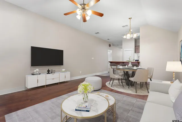 a living room with furniture and a flat screen tv