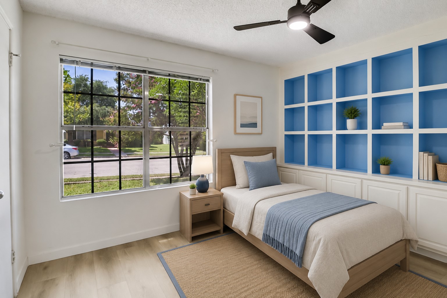 13827 Spring Heath Road Pflugerville, TX 78660 - Photo 16 of 20 A naturally illuminated bedroom offers versatile built-in shelving, perfect for personalization. Digitally Staging.