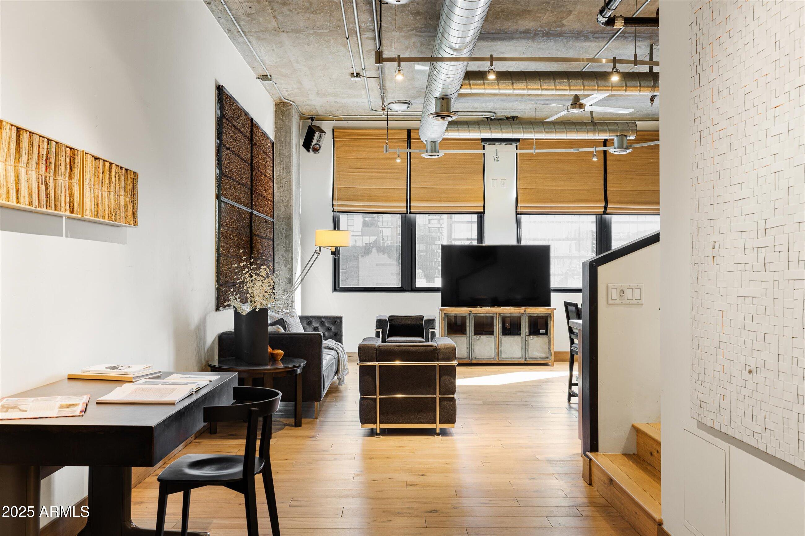 21 East 6th Street, Unit 507 Tempe, AZ 85281 - Photo 12 of 35 a living room with furniture and a flat screen tv
