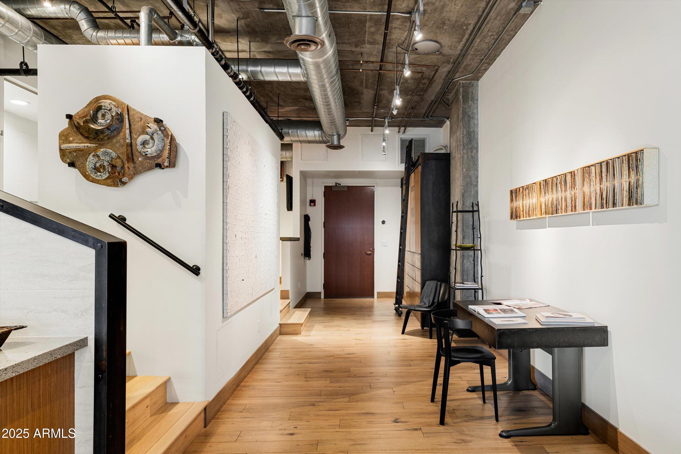21 East 6th Street, Unit 507 Tempe, AZ 85281 - Photo 2 of 35 a view of a hallway with entryway dining room and hall with wooden floor