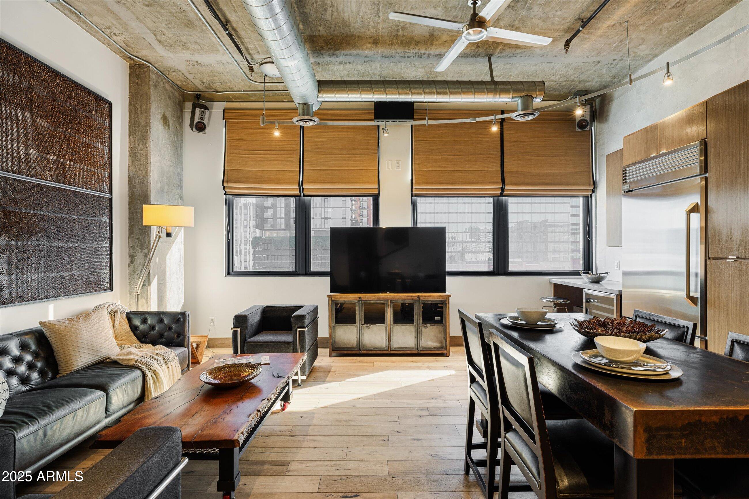 21 East 6th Street, Unit 507 Tempe, AZ 85281 - Photo 22 of 35 a living room with furniture and a flat screen tv