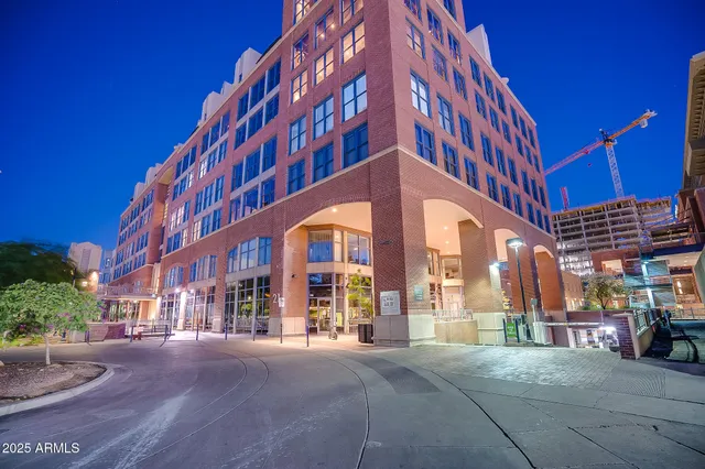 a view of a building with a yard