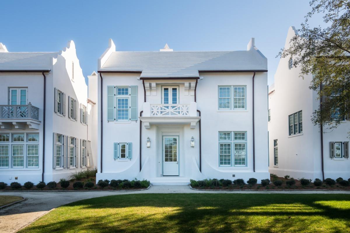 83 Whalebone Alley Inlet Beach, FL 32461 - Photo 1 of 15 a front view of a house with swimming pool and large windows