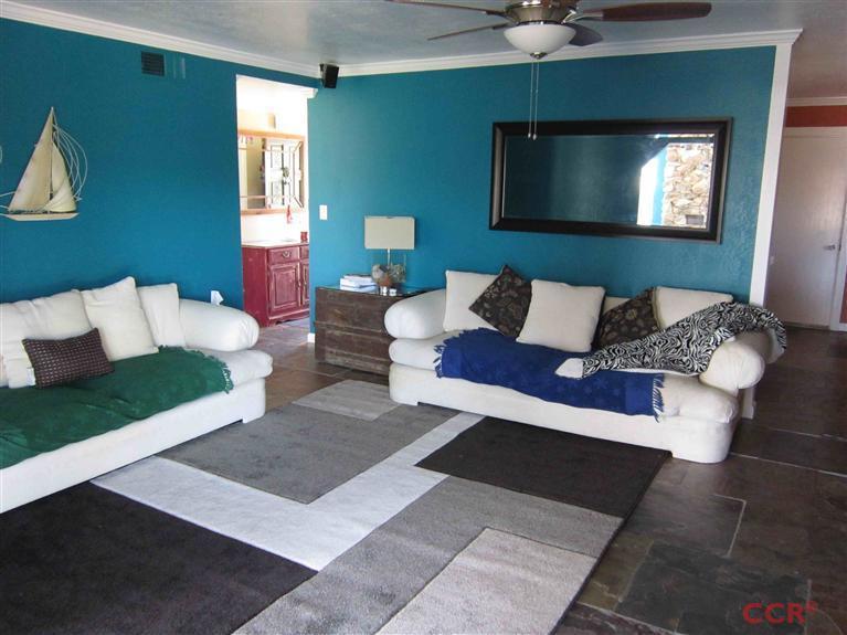 3901 Rigel Avenue Lompoc, CA 93436 - Photo 13 of 17 a living room with furniture and a flat screen tv