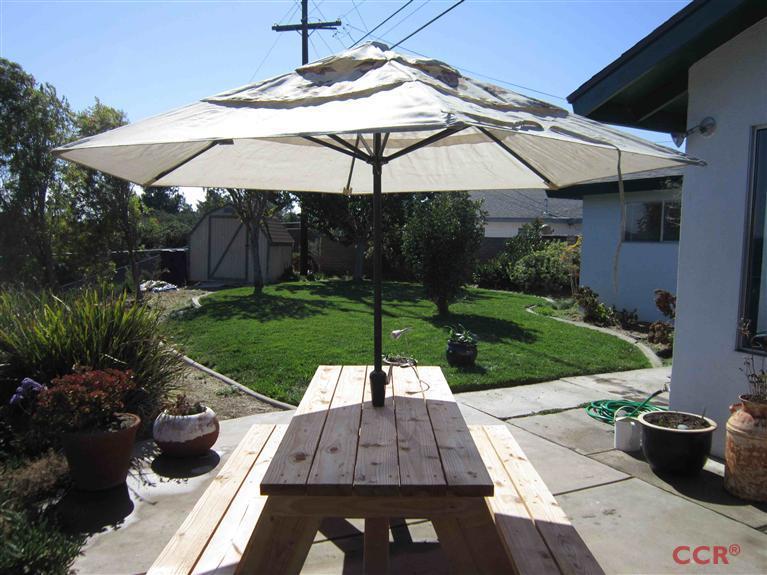 3901 Rigel Avenue Lompoc, CA 93436 - Photo 4 of 17 a view of a backyard with sitting area
