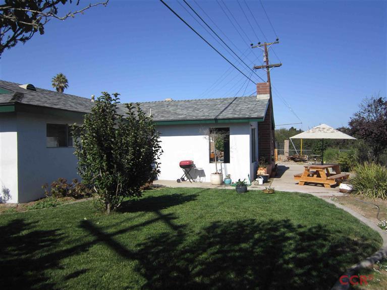 3901 Rigel Avenue Lompoc, CA 93436 - Photo 5 of 17 a front view of a house with a garden and patio