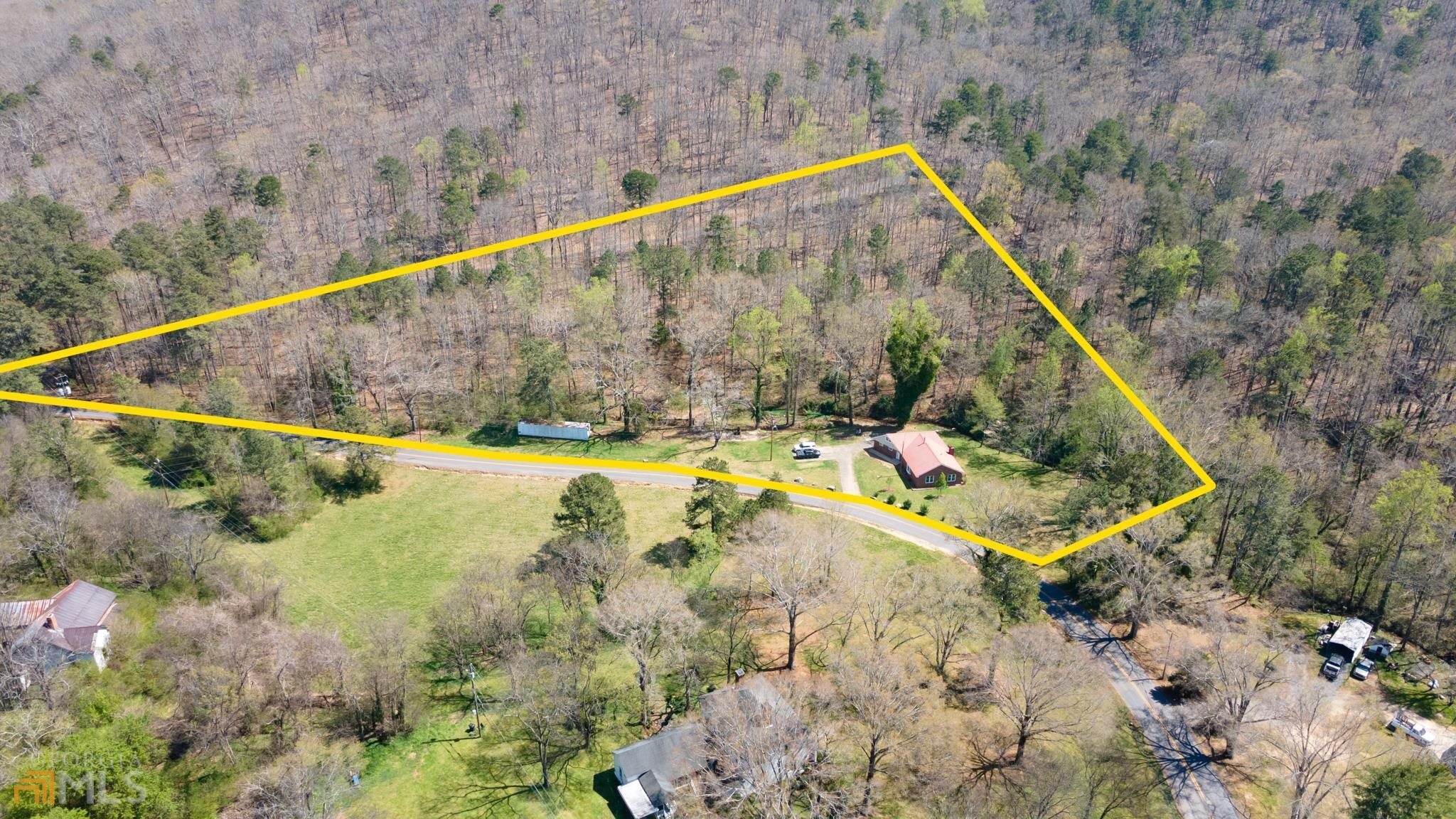 1404 East Hermitage Road Rome, GA 30161 - Photo 1 of 1 a view of a small pool with a yard