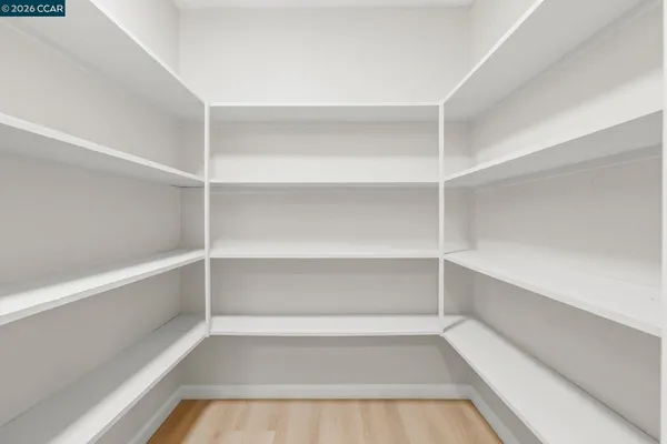 a view of a room with shelves on the wall