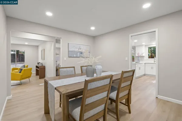 a view of a dining room with furniture and a wooden floor