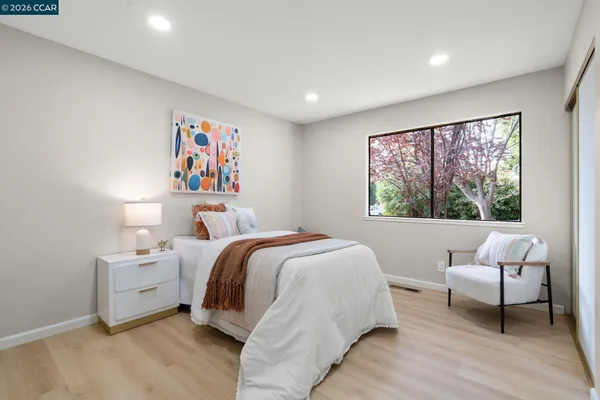 a bedroom with a bed and a couch