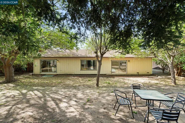 a house with trees in the background
