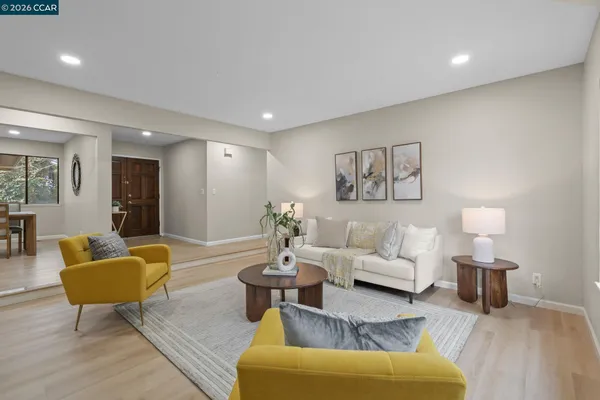 a living room with furniture and a lamp