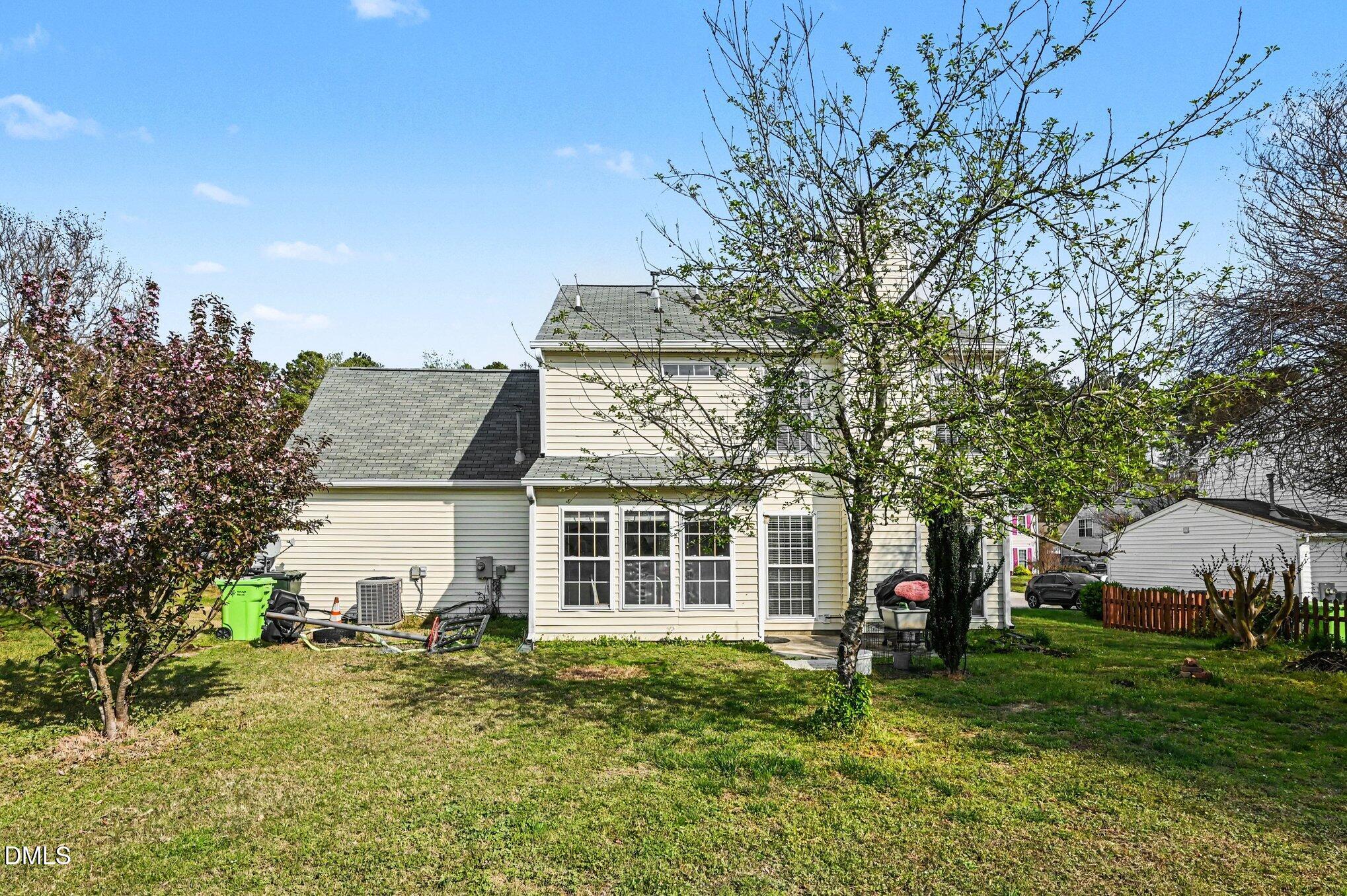 5115 Cardinal Grove Boulevard Raleigh, NC 27616 - Photo 24 of 36 a view of a house with a yard