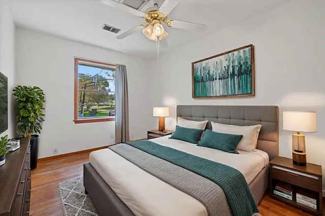 a bedroom with a bed and a window