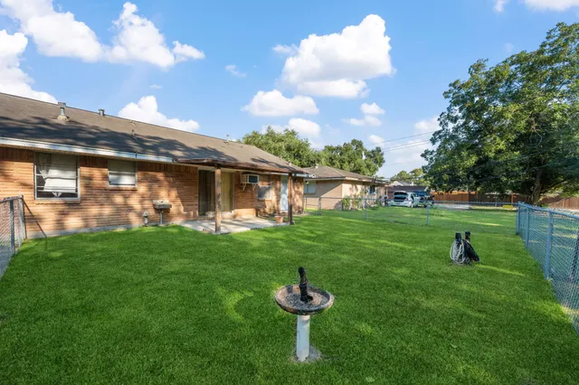 a backyard of a house with lots of green space