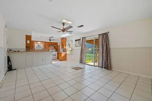 a view of a kitchen with furniture and windows