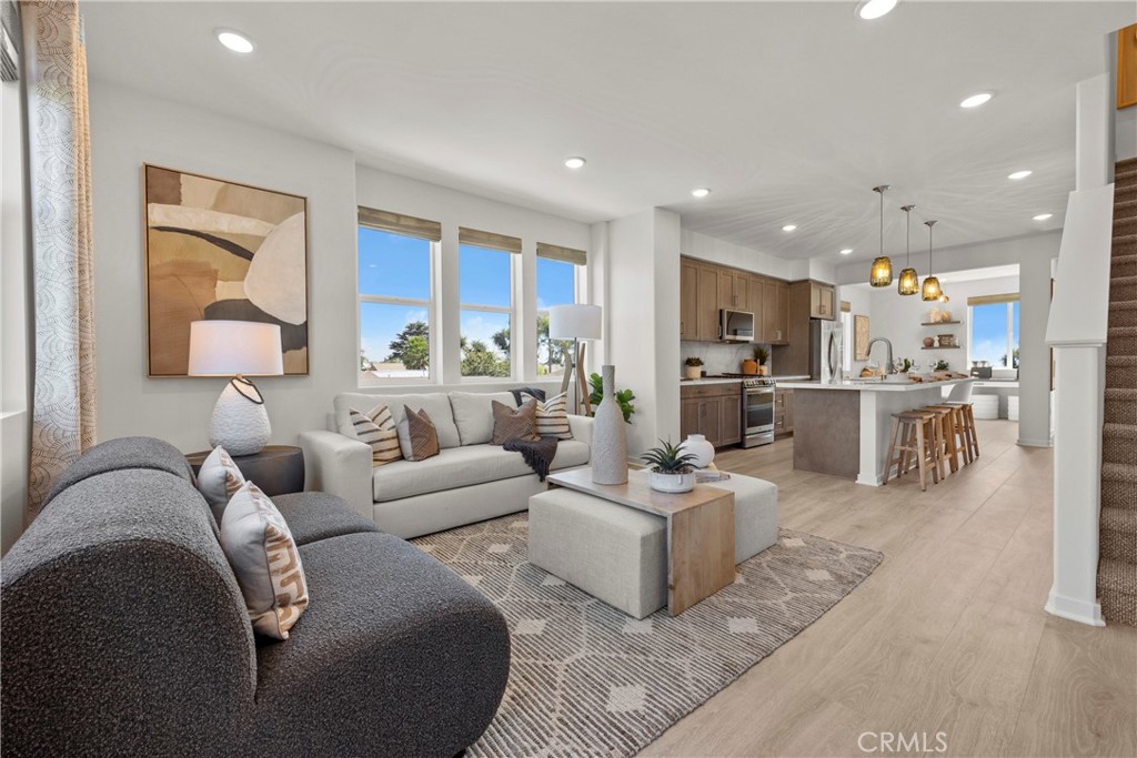 1950 West Sycamore Drive Compton, CA 90220 - Photo 12 of 23 a living room with furniture and a view of kitchen