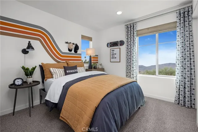 a bedroom with bed and a window