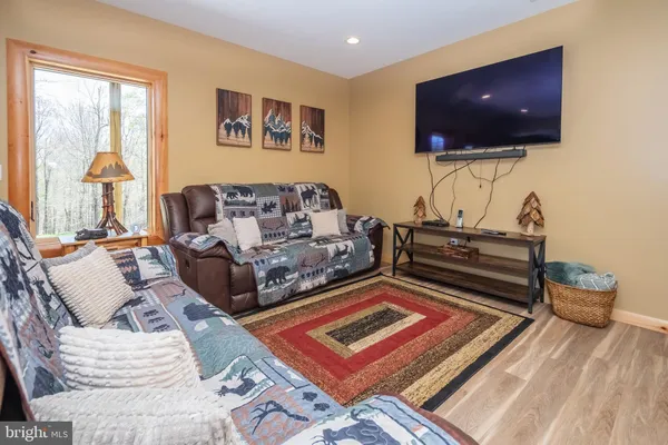 a bedroom with a bed and a couch