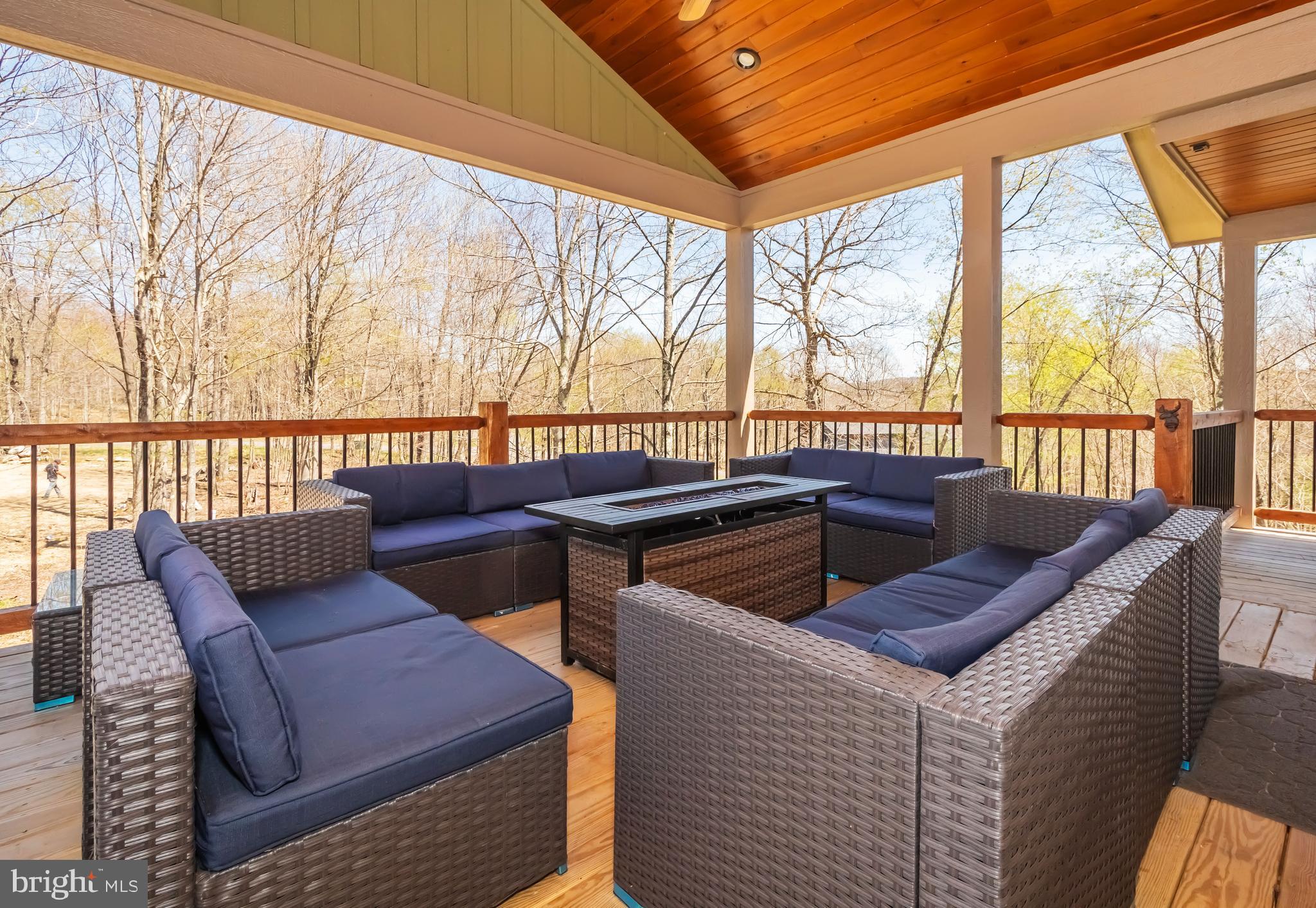 94 Sandy View Oakland, MD 21550 - Photo 55 of 64 a view of a patio with couches chairs and wooden floor