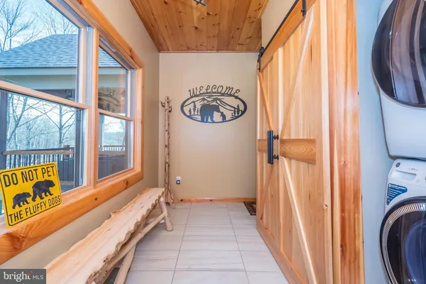 a kitchen with sink cabinets and wooden floor