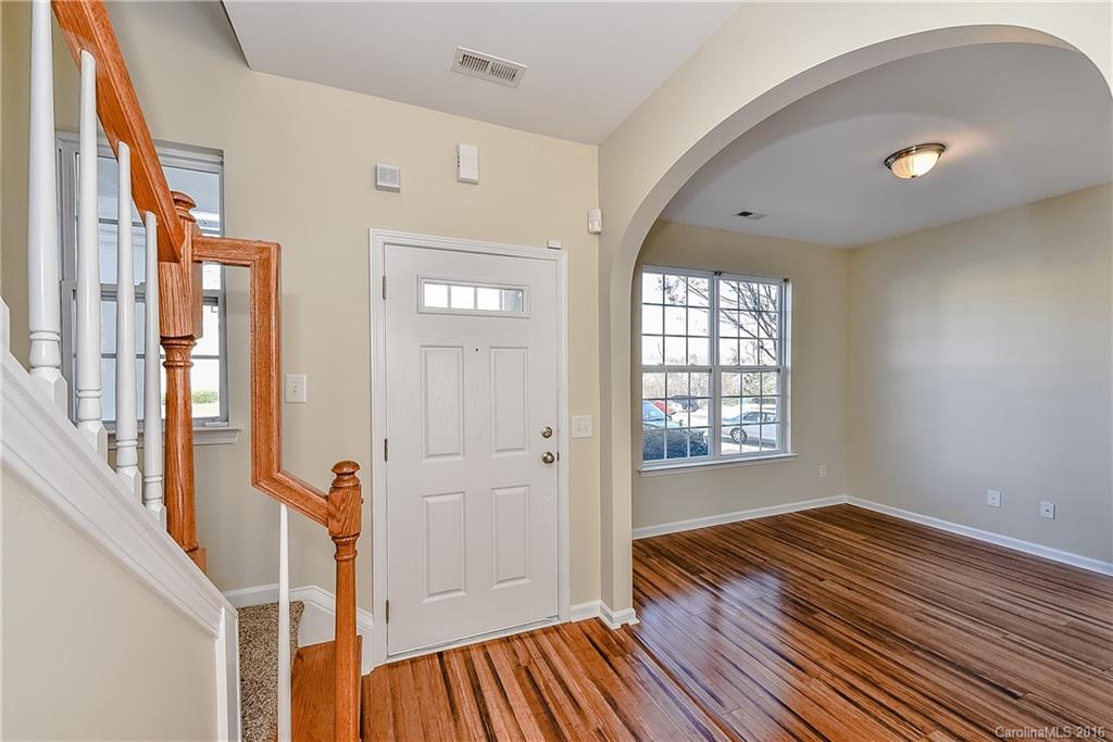 316 Sugar Ridge Court, Unit 95 Fort Mill, SC 29708 - Photo 2 of 23 a view of an empty room with wooden floor and a window
