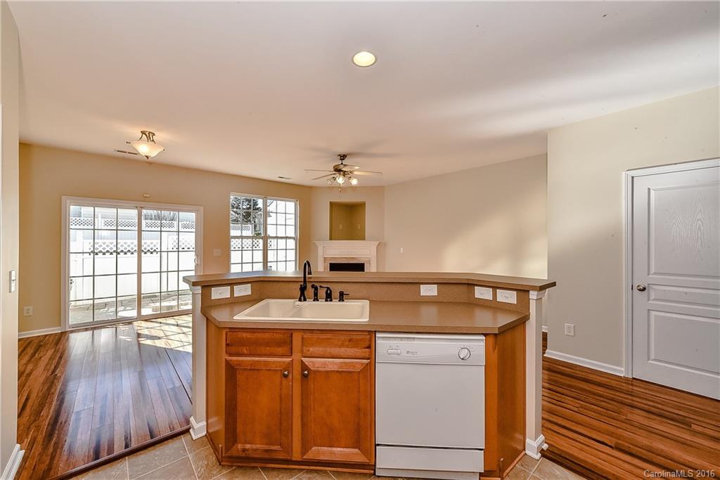 316 Sugar Ridge Court, Unit 95 Fort Mill, SC 29708 - Photo 12 of 23 a kitchen with a sink stove and cabinets