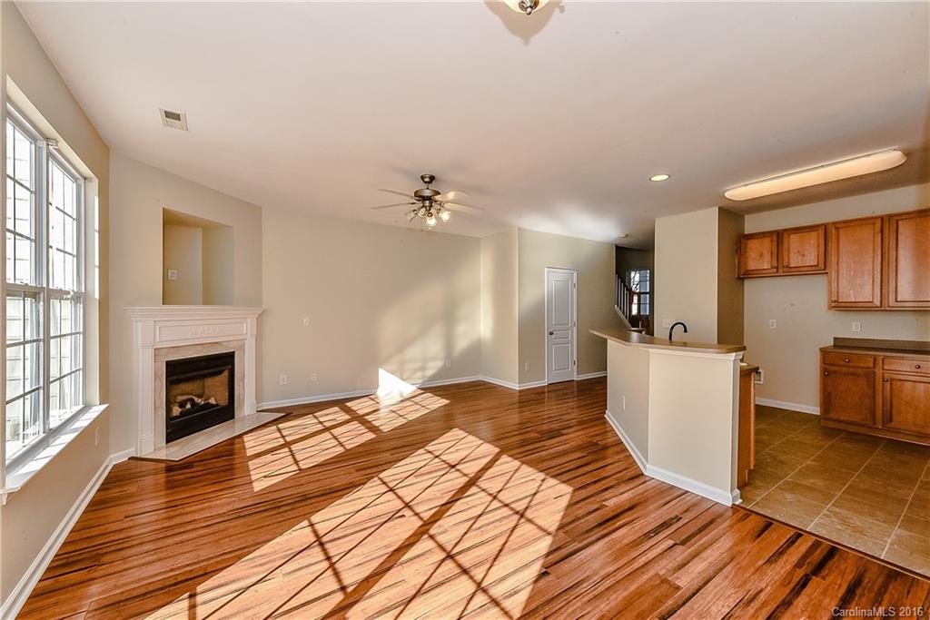 316 Sugar Ridge Court, Unit 95 Fort Mill, SC 29708 - Photo 13 of 23 a bedroom with a bed and a fireplace