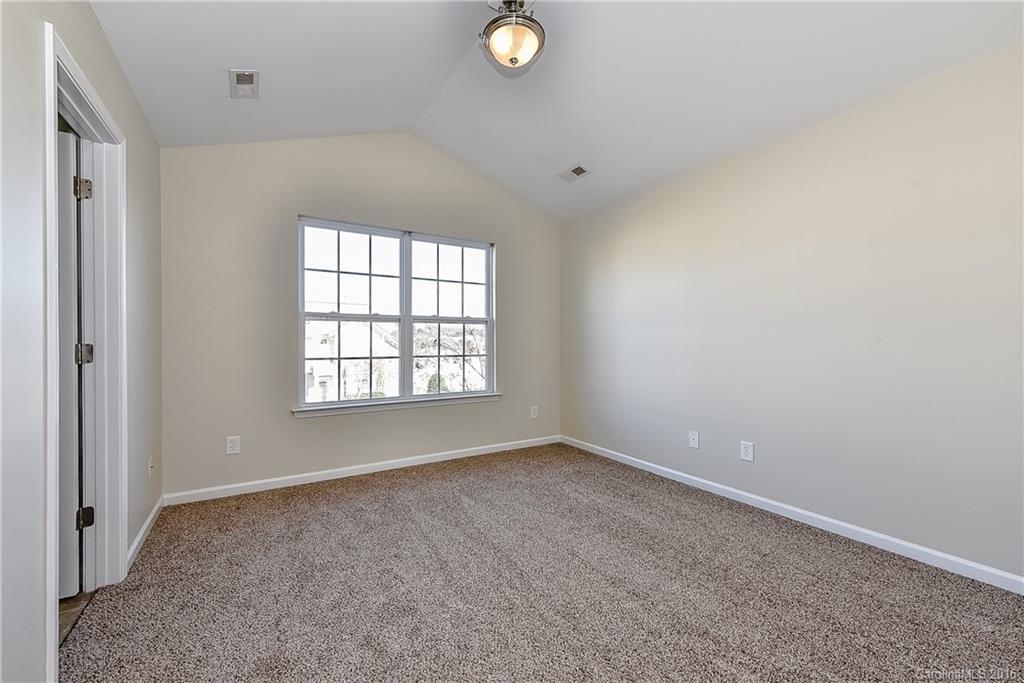 316 Sugar Ridge Court, Unit 95 Fort Mill, SC 29708 - Photo 15 of 23 an empty room with windows