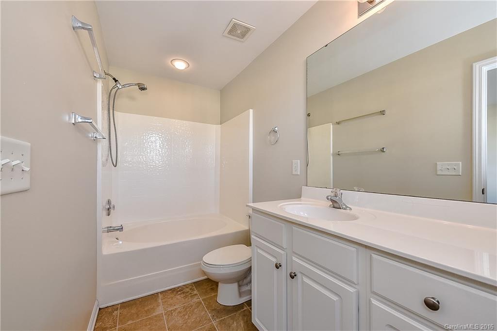 316 Sugar Ridge Court, Unit 95 Fort Mill, SC 29708 - Photo 17 of 23 a bathroom with a sink a toilet and shower