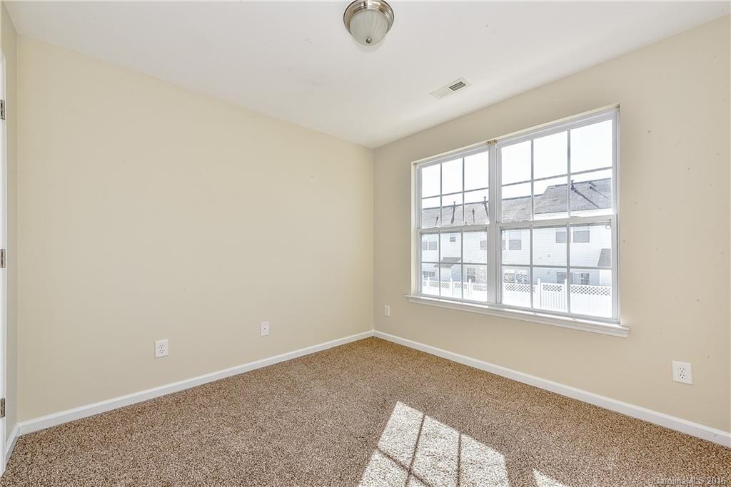 316 Sugar Ridge Court, Unit 95 Fort Mill, SC 29708 - Photo 18 of 23 an empty room with windows