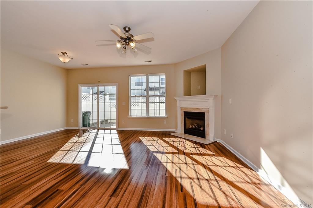 316 Sugar Ridge Court, Unit 95 Fort Mill, SC 29708 - Photo 7 of 23 a bedroom with a bed and a fireplace