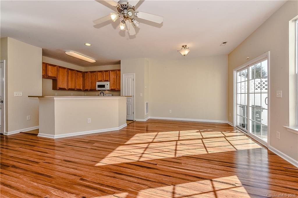 316 Sugar Ridge Court, Unit 95 Fort Mill, SC 29708 - Photo 9 of 23 a view of a room with kitchen appliances and wooden floor