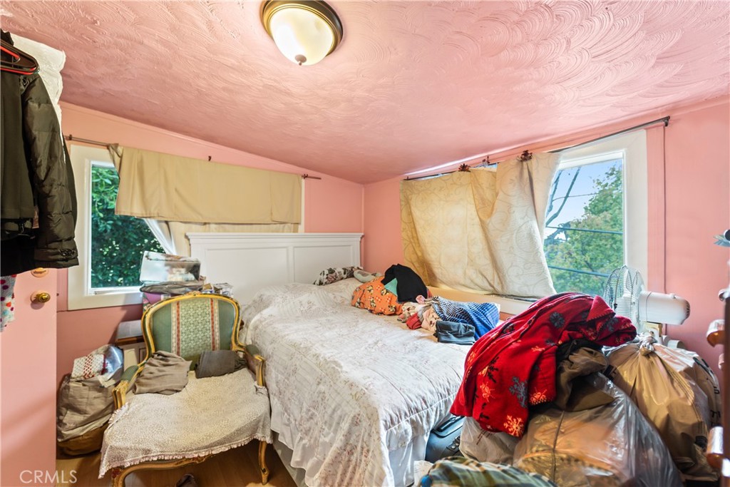 2424 West Boulevard Los Angeles, CA 90016 - Photo 16 of 21 a view of a bedroom with furniture and a window