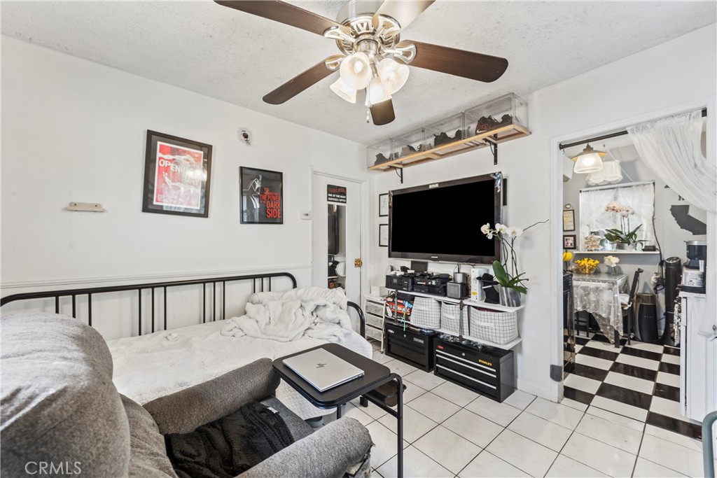 2424 West Boulevard Los Angeles, CA 90016 - Photo 8 of 21 a living room with furniture and a flat screen tv