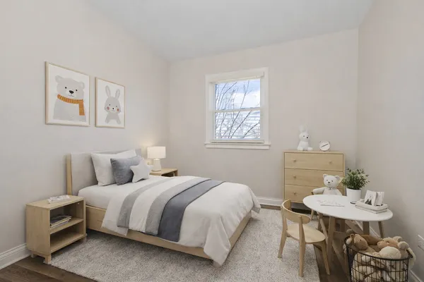 a bedroom with a bed and a table in it