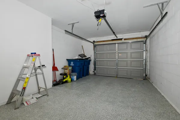 a view of a garage with rack and white walls