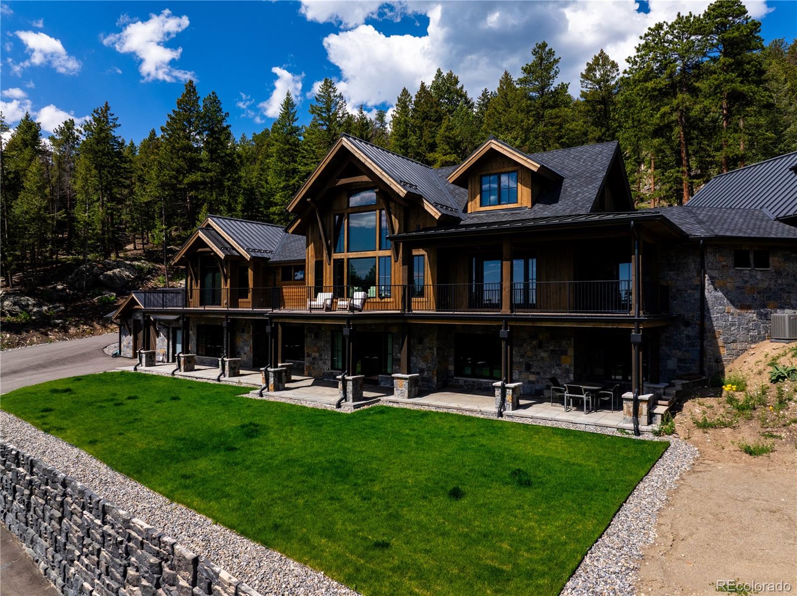 a front view of a house with a yard table and chairs