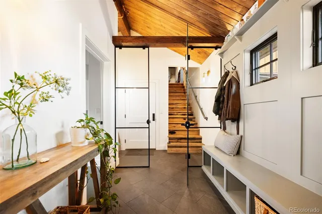 a view of entryway and hall with wooden floor
