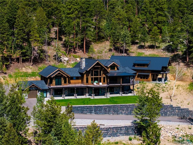 a aerial view of a house with a big yard