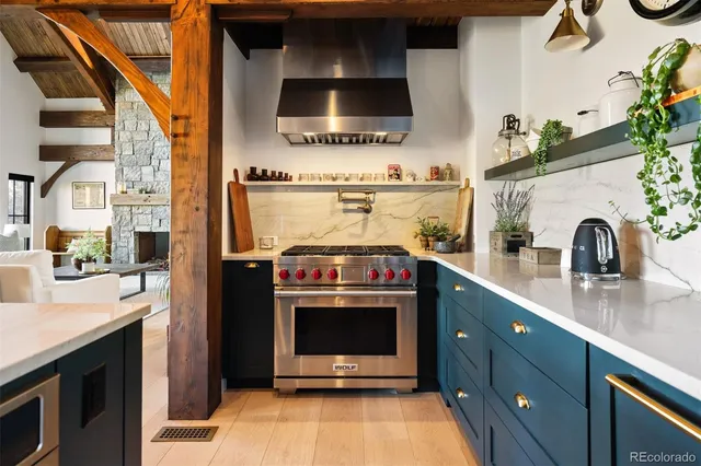 a kitchen with a stove and a sink