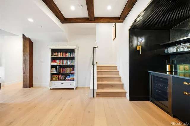a view of an empty room with stairs and ventilation