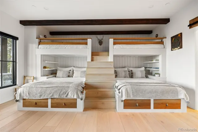 a bedroom with a bed and window