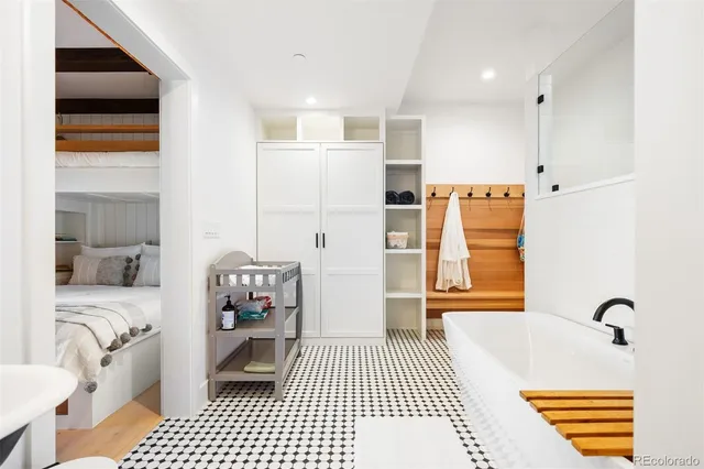 a bathroom with a bathtub and a shower