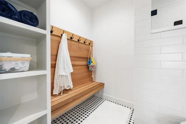 a view of staircase with white walls and a window