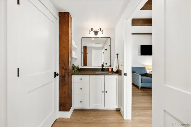 a bathroom with a sink and a mirror