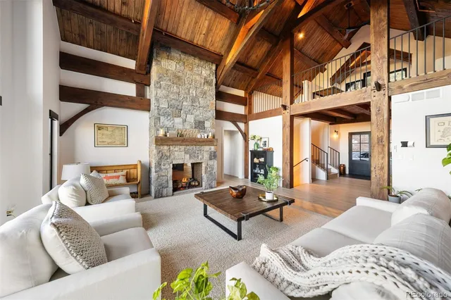 a living room with furniture fireplace and a fireplace