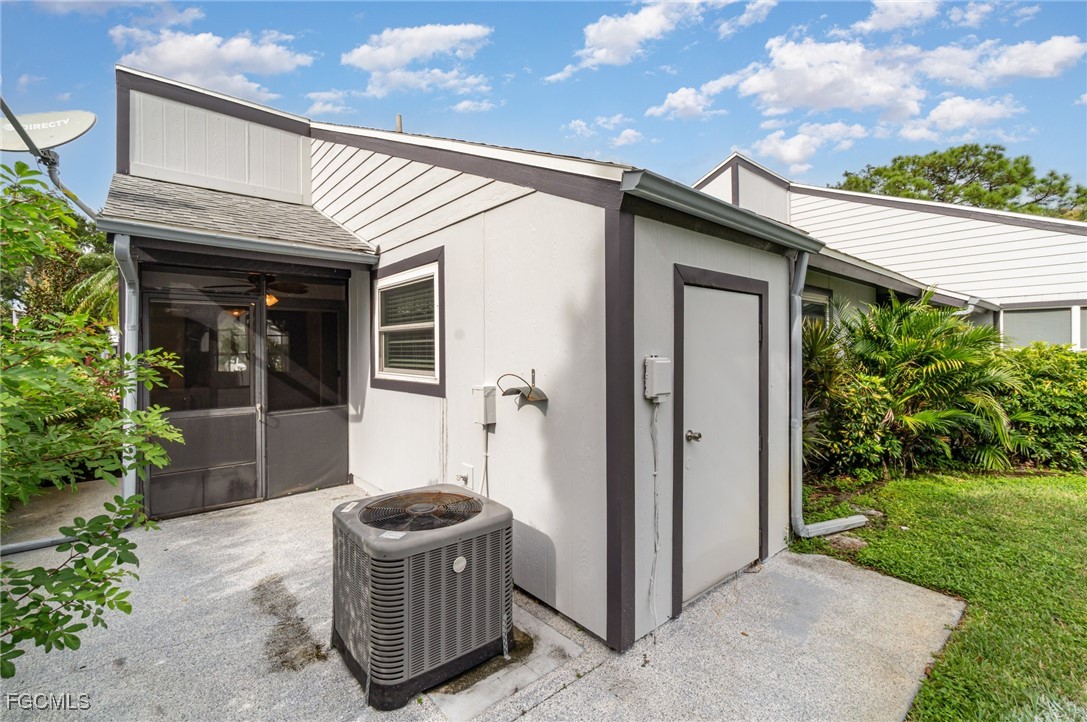 10615 Roxbury Court Lehigh Acres, FL 33936 - Photo 24 of 33 a view of a patio with table and chairs and potted plants