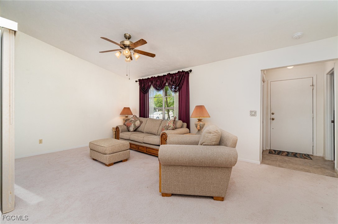 10615 Roxbury Court Lehigh Acres, FL 33936 - Photo 4 of 33 a living room with furniture